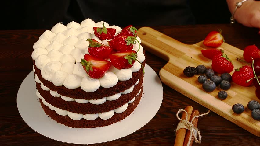 Female Hands Decorating Chocolate Cake Stock Footage Video 100