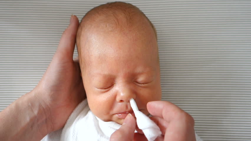 mom-cleans-the-newborns-nose-stock-footage-video-100-royalty-free