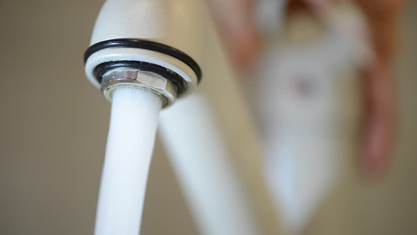 Hd00 30a Macro Of Running Water From Bathroom Faucet Spout Starts