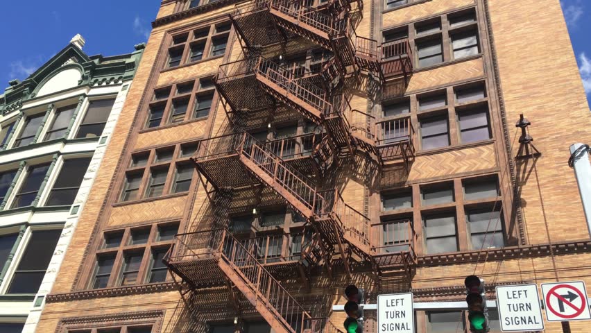 A Daytime Elishing Shot Of Stock Footage Video 100 Royalty A Daytime Elishing Shot Of An Apartment Or Office Building With Fire Escape On The Front