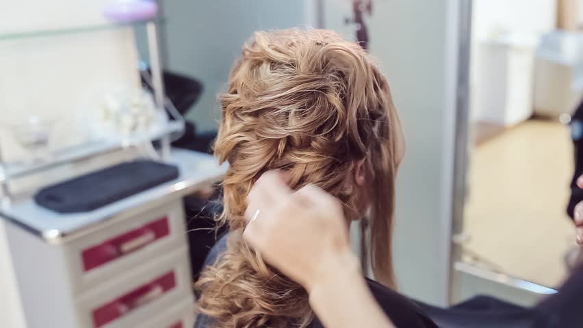 Hair Stylist Makes Professional Hairstyle Stock Footage Video 100