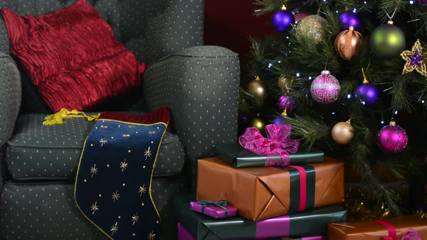 hd0011festive christmas scene with comfortable chair beside a christmas tree with jewel color decorations panning right close up - Jewel Colored Christmas Decorations hd0011festive christmas scene with comfortable chair beside a christmas tree with jewel color decorations panning right close up - Jewel Colored Christmas Decorations