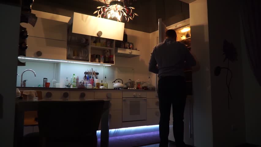Apartment Inside Night one person inside apartment loft home. urban night lights Apartment Inside Night one person inside apartment loft home. urban night lights