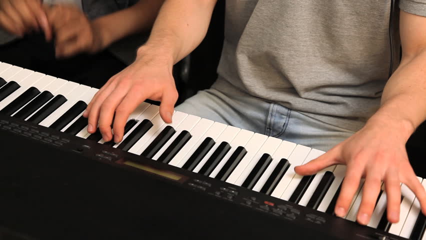 a student learning how to playing piano