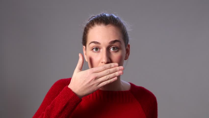 Жест серый. Covering mouth. Женщина выиграла квартиру. Covering your mouth while talking. The woman Covers her mouth with her hand and smiles Video.