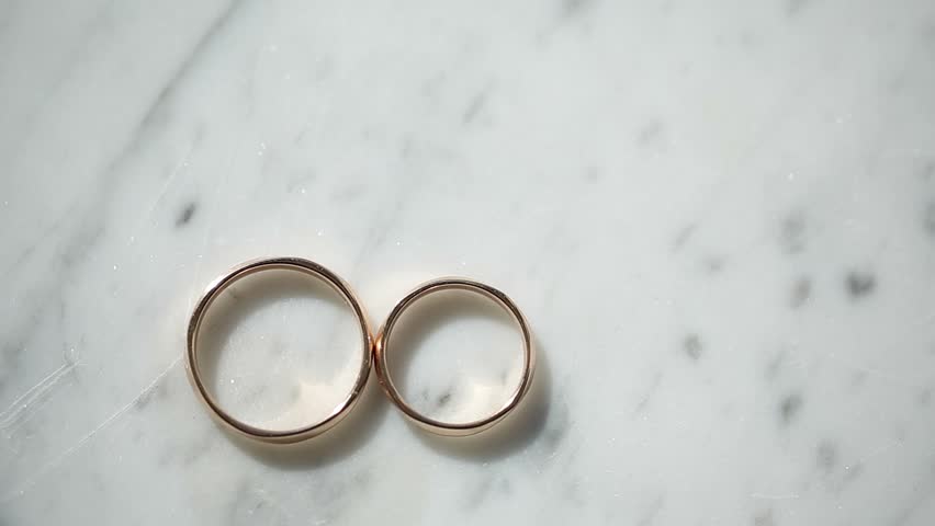 Wedding Rings Rotating With Textured Background Stock Footage Video ...