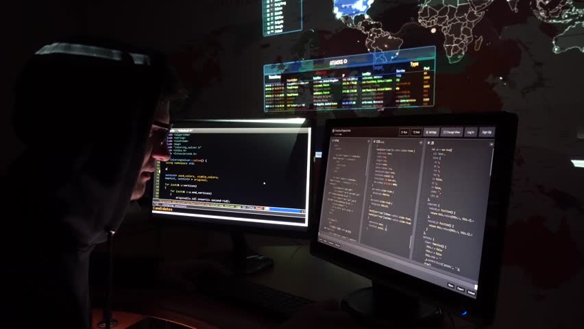 A Computer Programmer  Or Hacker Busy At Work Surrounded By 