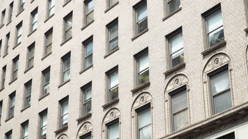 Brick Apartment Building Window exterior establishing shot of a new york style apartment building Brick Apartment Building Window exterior establishing shot of a new york style apartment building