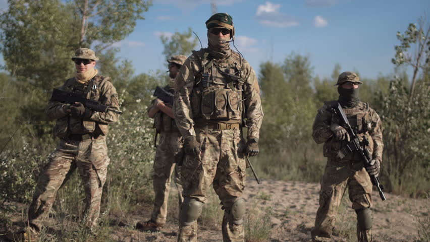 Group Of Soldiers Are Standing In A Circle And Listening Orders From ...