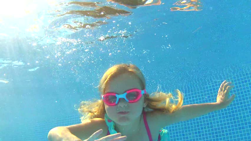 Happy Girl In Goggles Swim Underwater In Pool. Close Up Stock Footage ...