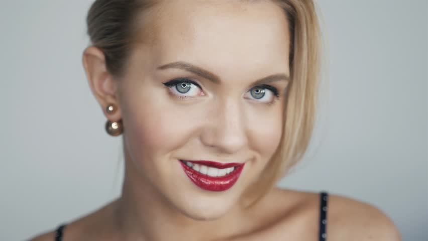 Beautiful Woman With Bright Glamour Make Up Red Lips And Nails Blonde Hair Clean Skin Dark Backgroud Sexy Model Beautiful Woman With Bright Glamour Make Up Red Lips And Nails Blonde Hair Clean Skin Dark Backgroud Sexy Model