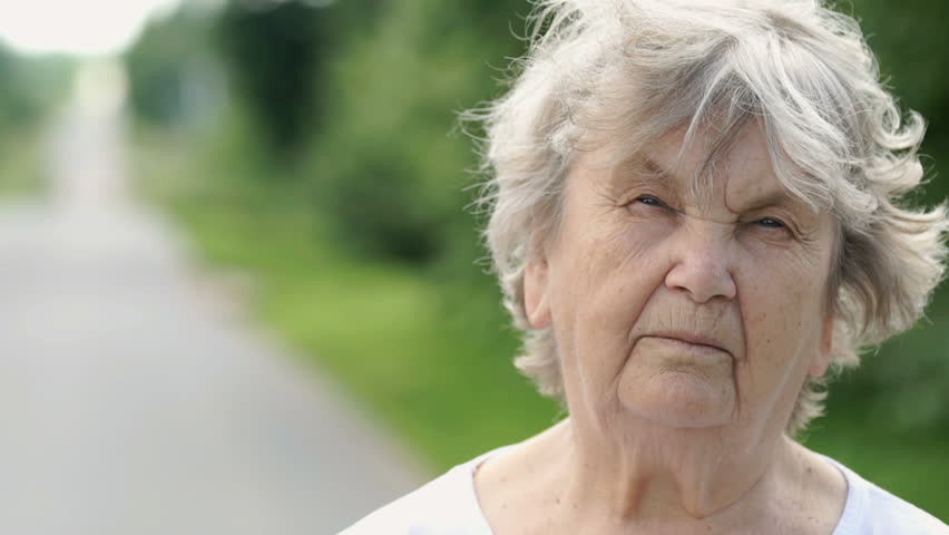 Half Face Of Serious Mature Old Woman With Gray Hair Aged 80s Outdoors ...