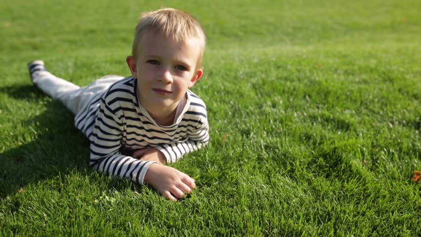 Boy Lying In The Grass Stock Footage Video 804181 | Shutterstock