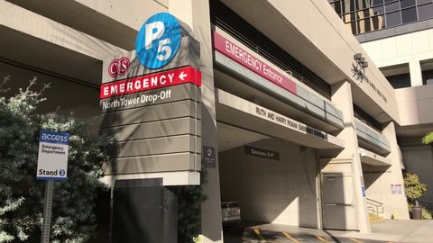 Los Angeles Oct 11th 2017 A Car Enters The Driveway Of The Emergency Room Entrance At Cedars Sinai Hospital And Medical Center In Los Angeles California With Ambient Sound