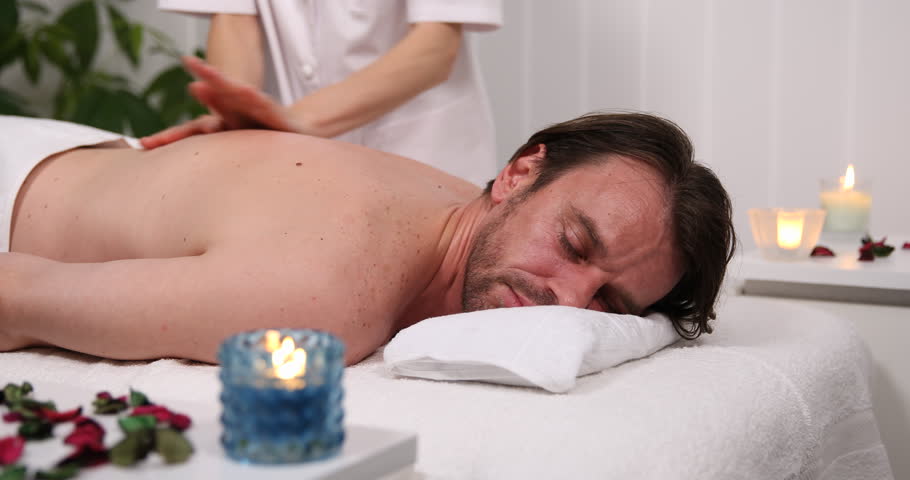 Handsome Client Man Receiving Back Body Massage In Luxury Health Beauty Spa Club Handsome Client Man Receiving Back Body Massage In Luxury Health Beauty Spa Club