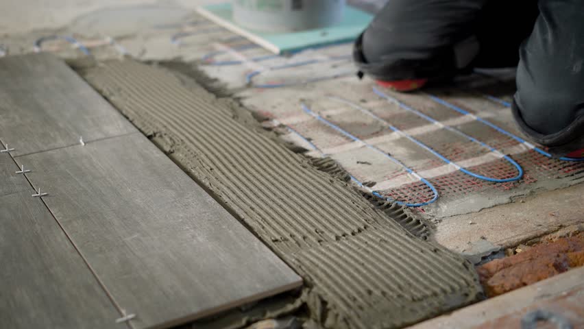 Tiler Is Installing Ceramic Floor Stockvideos Filmmaterial 100