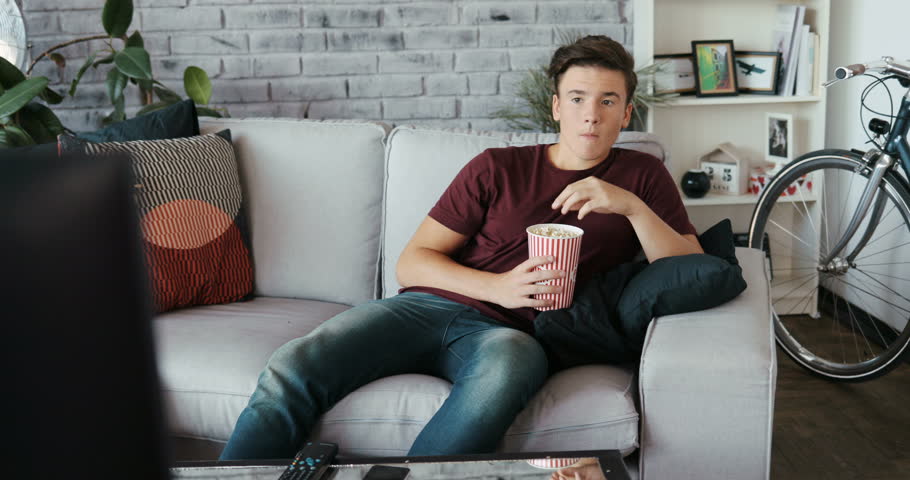 Lazy Man Sitting On Sofa Stock Footage Video 100 Royalty Free