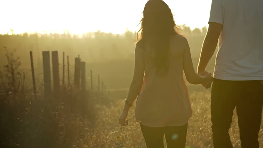 Couple holding hands in a quiet moment