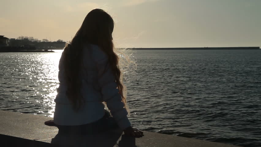A sad girl crying on the beach - Reverse cowgirl A sad girl crying on the beach