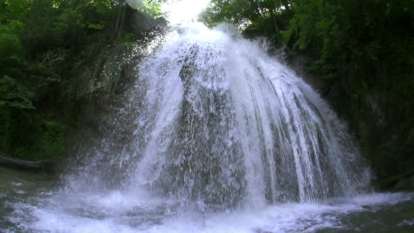 waterfall in mountains in slow motion, high speed reel. super slow motion dolly