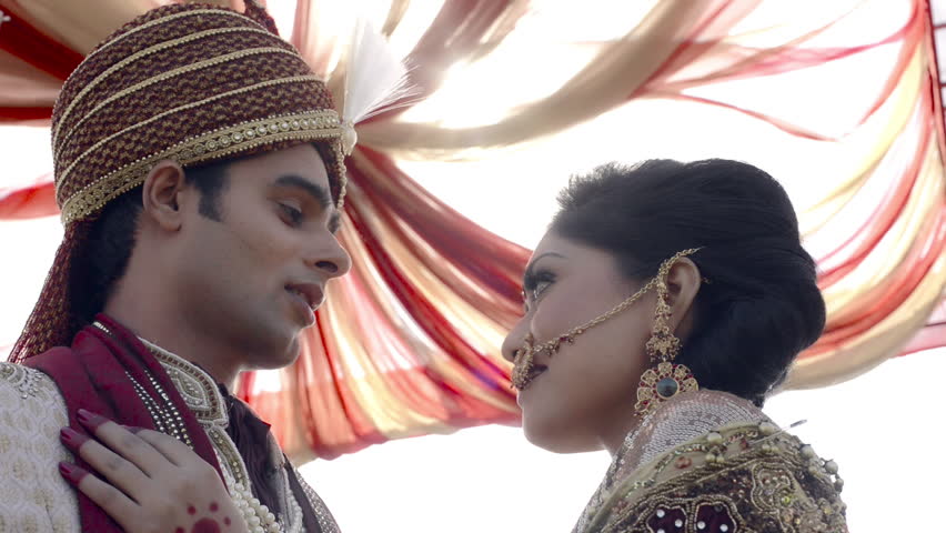 Shot Of Indian Bride And Groom In Traditional Wedding Dress Posing