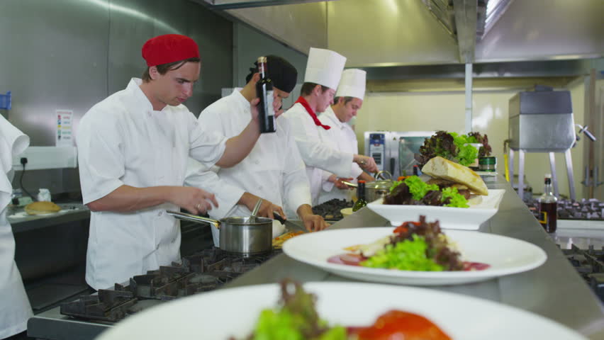 Restaurant Kitchen Video group of chefs giving plates on order line in a restaurant kitchen Restaurant Kitchen Video group of chefs giving plates on order line in a restaurant kitchen