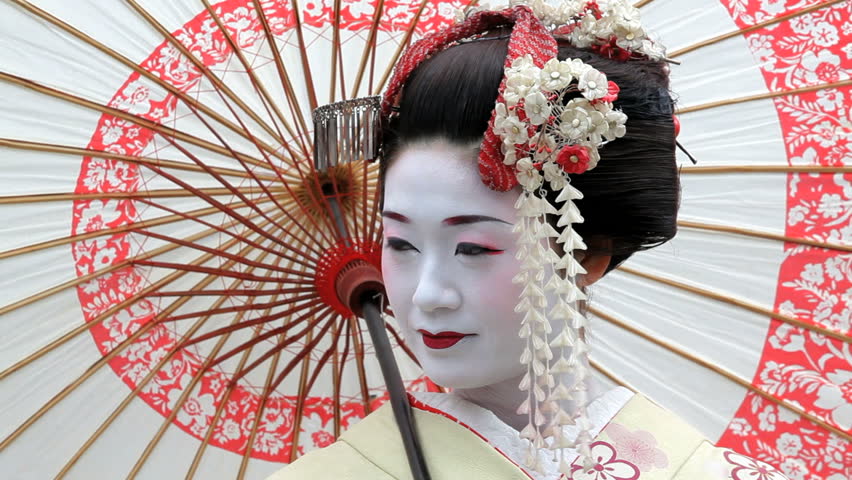 Japan - March 2011: Japanese Geisha Performer Posing With 