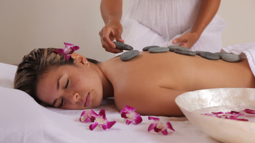 Woman Gets Hot Stone Spa Treatment Woman Gets Hot Stone Spa Treatment