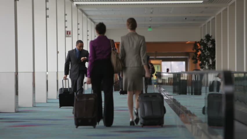 Business People Meet And Shake Hands In Airport Lobby Stock Footage ...