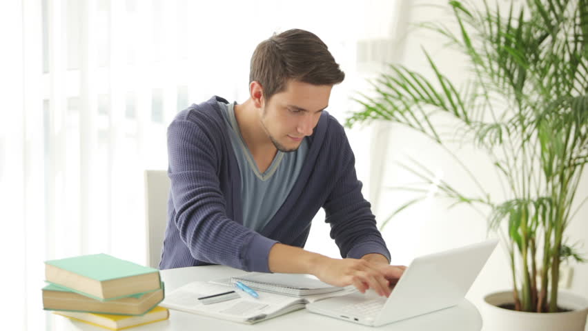 Cheerful Guy Sitting at Table Stock Footage Video (100% Royalty ...