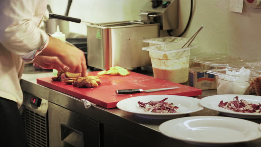 Restaurant Kitchen Video male chef in hotel or restaurant kitchen working and cooking meat Restaurant Kitchen Video male chef in hotel or restaurant kitchen working and cooking meat