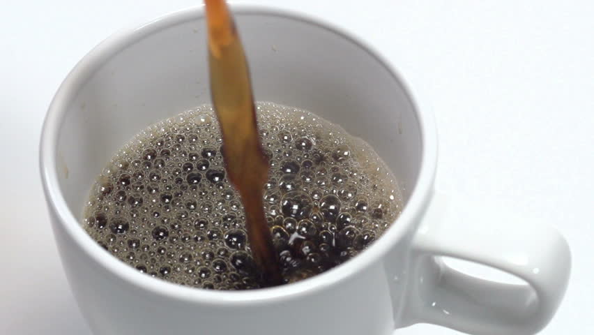 Slow Motion Close Up Of Coffee Pouring Into A Cup Slow Motion Close Up Of Coffee Pouring Into A Cup