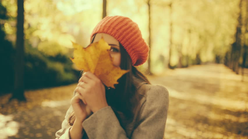 Young Woman Pulling Her Boyfriend Through Autumn Park With ...