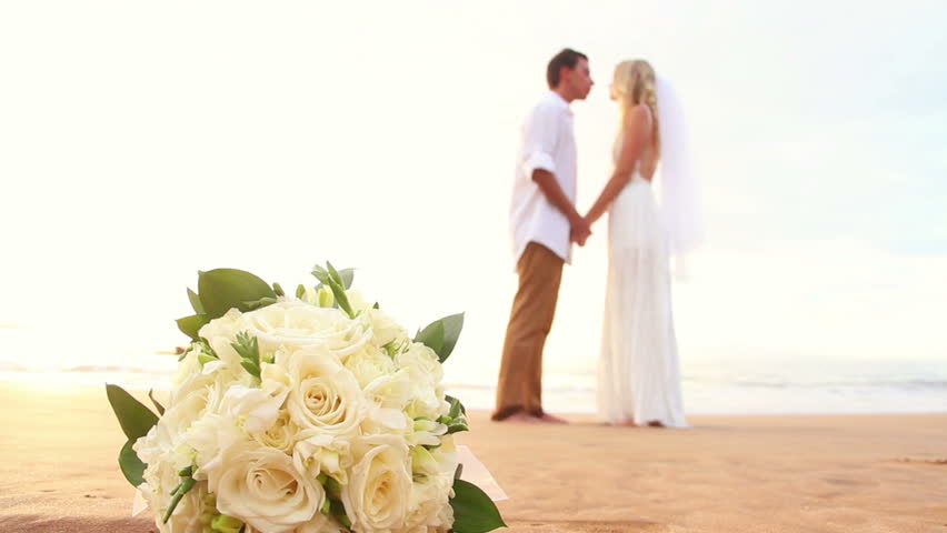 Newly Married On Tropical Beach After Sunset Wedding Newly Married Kissing On Tropical Beach After Sunset Wedding Bride And Groom