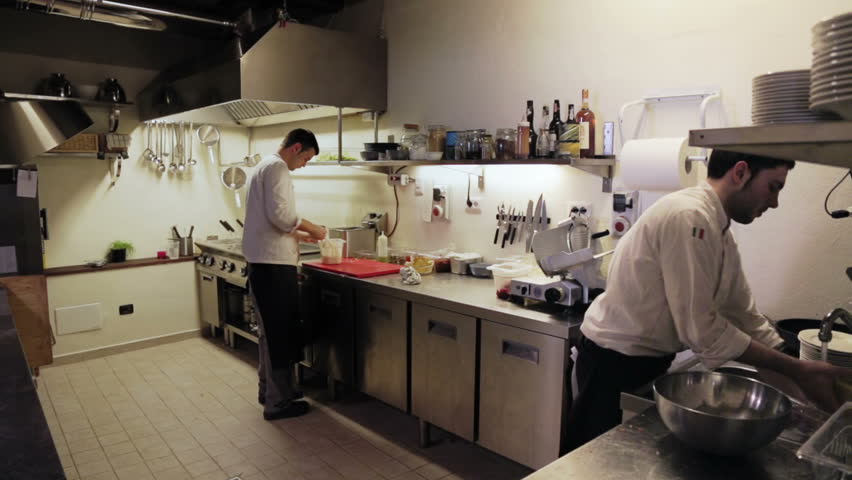 Restaurant Kitchen Video male chef in hotel or restaurant kitchen working and cooking meat Restaurant Kitchen Video male chef in hotel or restaurant kitchen working and cooking meat