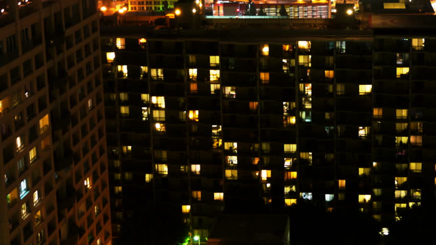 Apartment Building At Night time lapse of apartment building at night -zoom in- stock footage Apartment Building At Night time lapse of apartment building at night -zoom in- stock footage