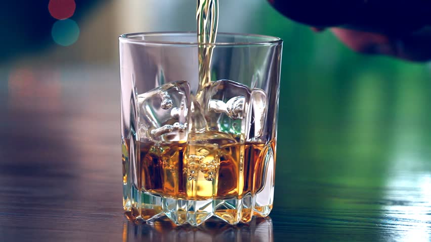 Pouring A Scotch Whiskey Into Glass With Ice Stock Footage Video ...