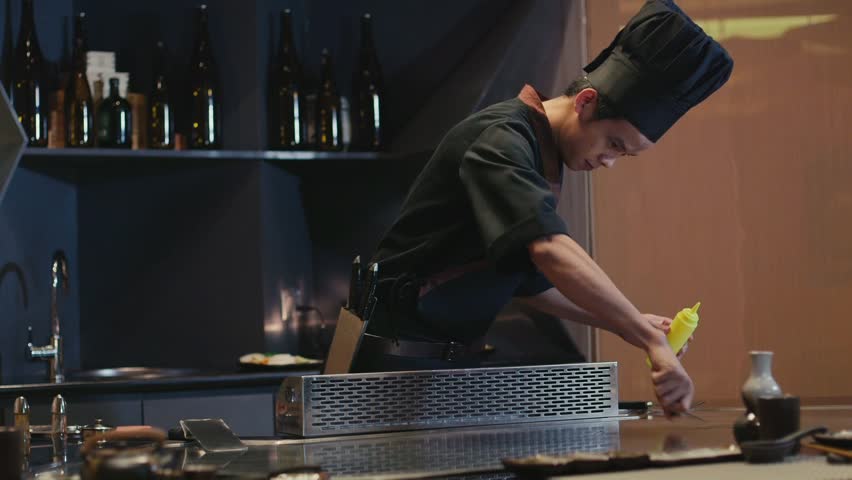 Restaurant Kitchen Video chef actively working in the kitchen of an asian restaurant, 4k Restaurant Kitchen Video chef actively working in the kitchen of an asian restaurant, 4k