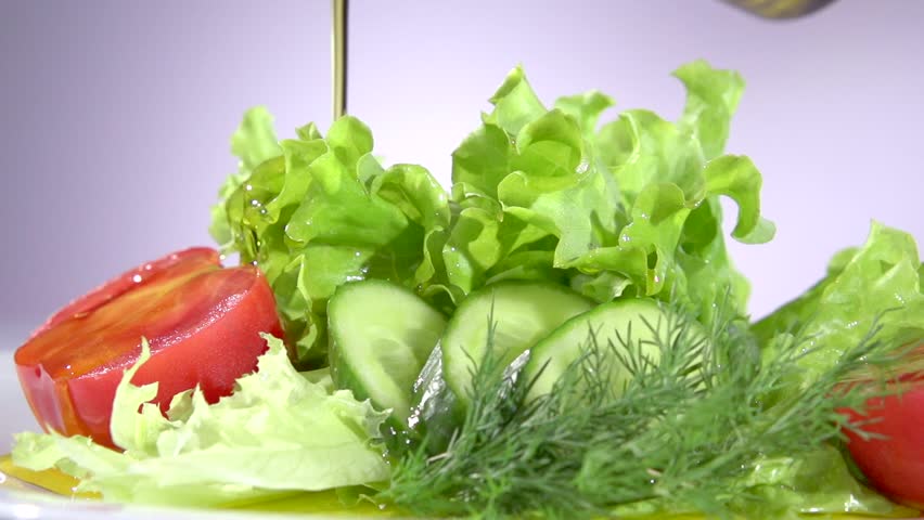 Healthy Vegetable Salad With Olive Oil Dressing Pouring 