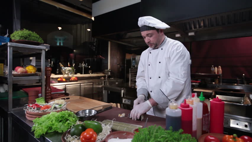 Restaurant Kitchen Video sushi chef making sushi rolls with cucumber, restaurant kitchen Restaurant Kitchen Video sushi chef making sushi rolls with cucumber, restaurant kitchen