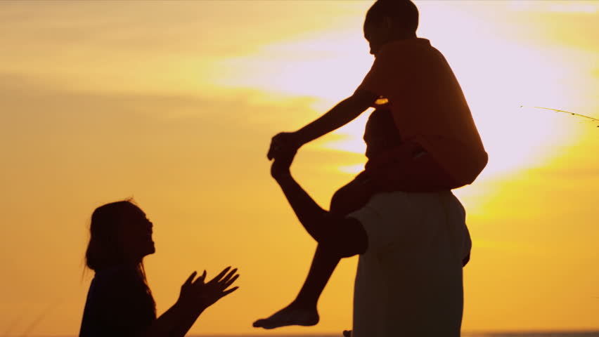 african american family sunset playing beach happy african american family playing together beach vacation sunset