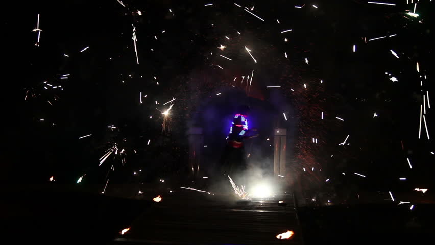 the welder works in the dark at building bright sparks from welding how a welder works