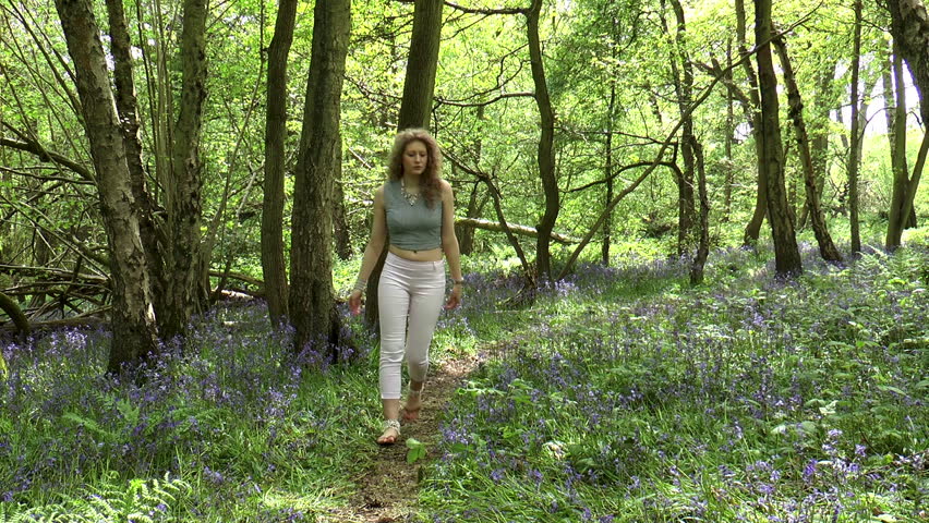 girl walking in woods