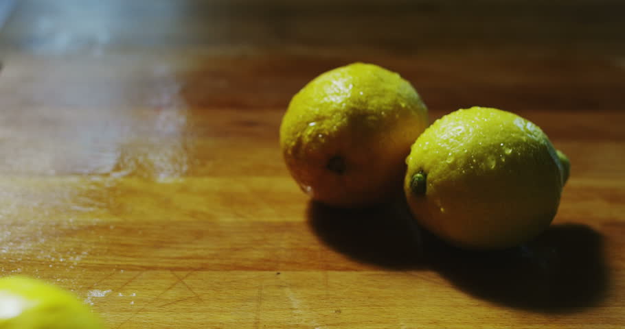 Kitchen Table Close Up macro close up of fresh juicy wet lemon fruit on a wooden Kitchen Table Close Up macro close up of fresh juicy wet lemon fruit on a wooden