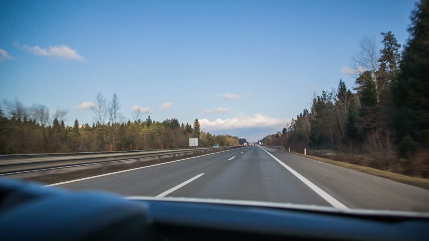 stock video of sunny highway drive. traveling on empty