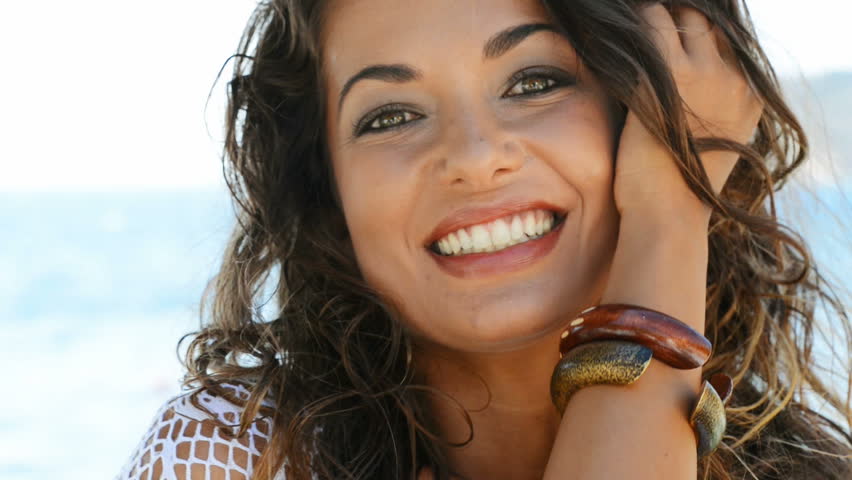 Beautiful Woman At Beach Looking At Camera. Smiling Young Woman In ...